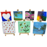 7 mini canvases painted in various colourful ways.