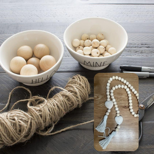 Wood beads in white dishes. A wood bead garland is inset.